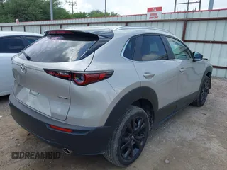 2024 Mazda CX-30 2.5 S Select Sport with VIN 3MVDMBBM6RM694560, listed as a IAAI auction lot 42172660 with 20,608 mi miles. Bid and sale history available at carsss.com. Image 4.
