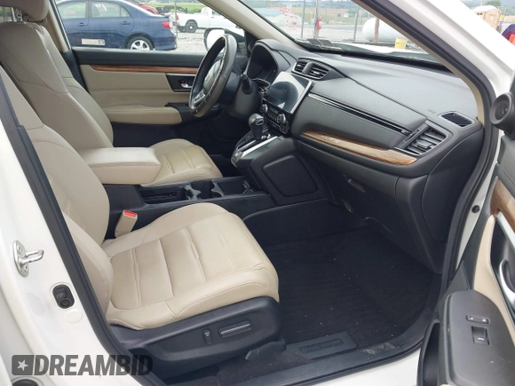 2018 Honda CR-V Touring with VIN 2HKRW2H91JH665241, listed as a IAAI auction lot 42638694 with 62,066 mi miles and . Bid and sale history available at DreamBid. Image 5.