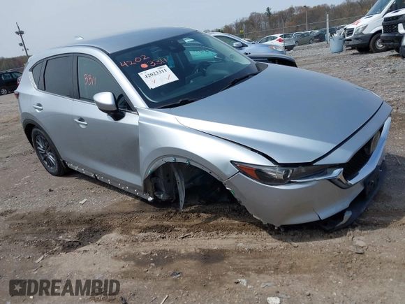 2020 Mazda CX-5 Touring with VIN JM3KFACM9L0785464, listed as a IAAI auction lot 42023311 with 90,062 mi miles and . Bid and sale history available at DreamBid. Image 1.