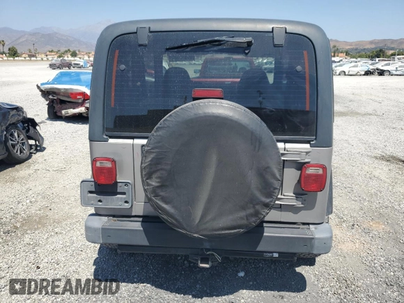 2000 Jeep Wrangler SE with VIN 1J4FA29P7YP737289, listed as a Copart auction lot 61869865 with 91,097 mi miles and Salvage title. Bid and sale history available at DreamBid. Image 6.