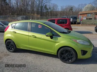 2011 Ford Fiesta SES with VIN 3FADP4FJ4BM108857, listed as a IAAI auction lot 41848272 with 138,943 mi miles. Bid and sale history available at carsss.com. Image 6.