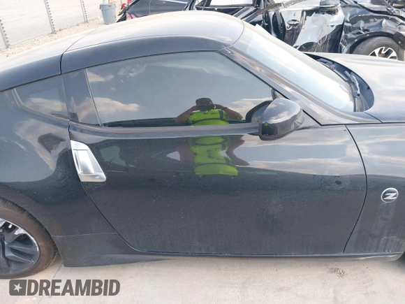 2015 Nissan 370Z z VIN JN1AZ4EH2FM442556, wystawiony jako IAAI lot #41956287 z przebiegiem 128 769 mil mil oraz . Historia ofert i sprzedaży dostępna na DreamBid. Obrazek 14.