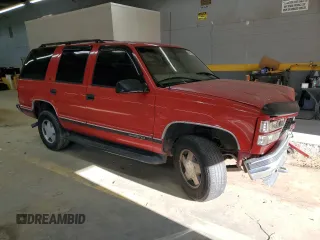 1999 GMC Yukon with VIN 1GKEK13R0XJ768859, listed as a Copart auction lot 84005304 with 190,960 mi miles and Salvage Title. Bid and sale history available at carsss.com. Image 4.