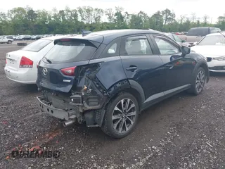 2019 Mazda CX-3 Touring z VIN JM1DKFC76K0446440, wystawiony jako IAAI lot #42314401 z przebiegiem 57 901 mil mil oraz . Historia ofert i sprzedaży dostępna na DreamBid. Obrazek 4.