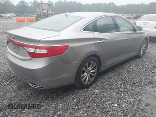 2013 Hyundai Azera z VIN KMHFG4JG7DA199553, wystawiony jako IAAI lot #42218944 z przebiegiem 131 959 mil mil oraz . Historia ofert i sprzedaży dostępna na DreamBid. Obrazek 4.