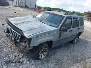 1995 Jeep Grand Cherokee Laredo with VIN 1J4GZ58S6SC756256, listed as a IAAI auction lot 42169534 with 255,516 mi miles. Bid and sale history available at carsss.com. Image 2.