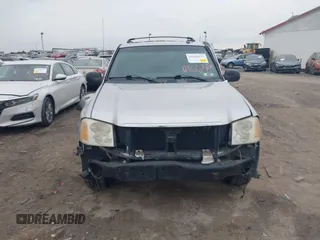 2004 GMC Envoy SLE with VIN 1GKDT13SX42135951, listed as a IAAI auction lot 41668252 with 216,193 mi miles. Bid and sale history available at carsss.com. Image 13.