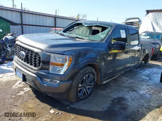 2021 Ford F-150 XL with VIN 1FTEW1C51MFC94173, listed as a IAAI auction lot 41628222 with 23,266 mi miles. Bid and sale history available at carsss.com. Image 2.