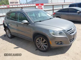 2011 Volkswagen Tiguan SEL w/Premium Navi with VIN WVGAV7AX0BW550059, listed as a IAAI auction lot 42071719 with 107,341 mi miles and . Bid and sale history available at DreamBid. Image 1.