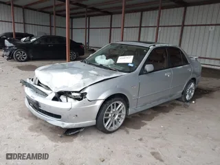 2003 Mazda Protege DX with VIN JM1BJ225030124381, listed as a IAAI auction lot 41607937 with 141,484 mi miles. Bid and sale history available at carsss.com. Image 17.