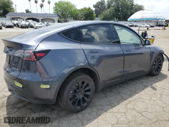 2023 Tesla Model Y Long Range with VIN 7SAYGDEE4PF899390, listed as a Copart auction lot 54361685 with Not Provided miles and Clean Title. Bid and sale history available at DreamBid. Image 3.