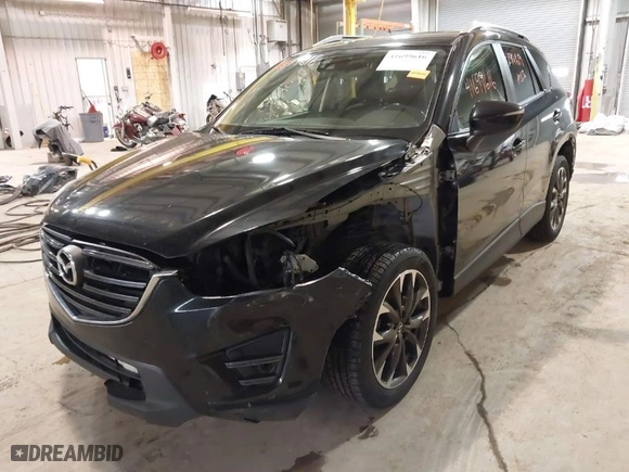 2016 Mazda CX-5 Grand Touring with VIN JM3KE2DY9G0635368, listed as a IAAI auction lot 41699616 with 240,619 mi miles. Bid and sale history available at carsss.com. Image 6.