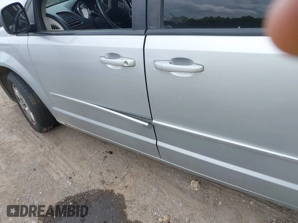 2011 Dodge Grand Caravan SXT with VIN 2D4RN4DGXBR600799, listed as a IAAI auction lot 42159972 with 257,571 mi miles and . Bid and sale history available at DreamBid. Image 12.