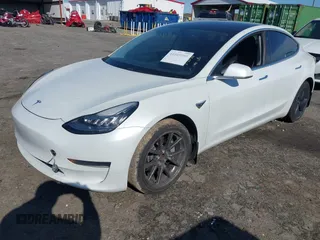 2020 Tesla Model 3 Standard Range Plus with VIN 5YJ3E1EA7LF797150, listed as a IAAI auction lot 41869088 with 75,708 mi miles and . Bid and sale history available at carsss.com. Image 17.