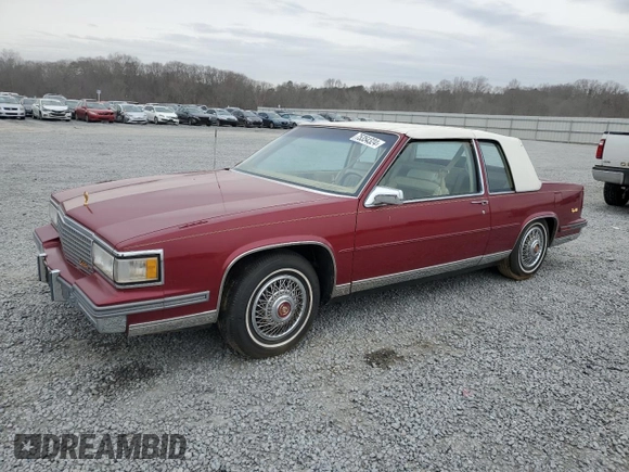 1987 Cadillac DeVille z VIN 1G6CD1181H4318101, wystawiony jako Copart lot #75354324 z przebiegiem Nie podano mil oraz Szkoda całkowita • Salvage title. Historia ofert i sprzedaży dostępna na DreamBid. Obrazek 1.