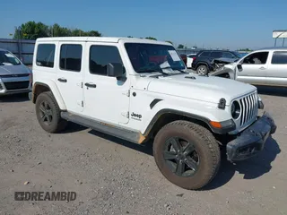 2021 Jeep Wrangler Unlimited Sahara Altitude with VIN 1C4HJXEG4MW669454, listed as a IAAI auction lot 42563303 with 111,535 mi miles and . Bid and sale history available at DreamBid. Image 1.