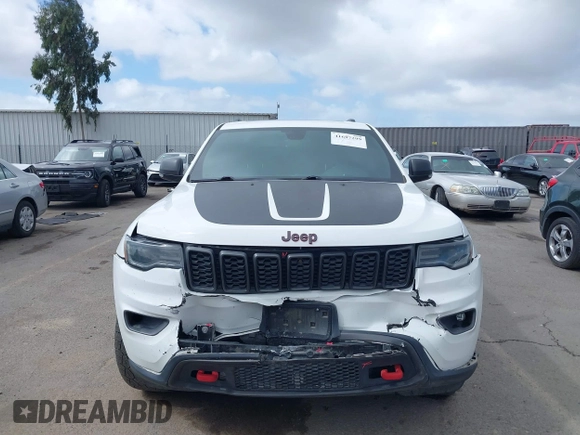 2018 Jeep Grand Cherokee Trailhawk with VIN 1C4RJFLT2JC137793, listed as a IAAI auction lot 41697299 with 149,100 mi miles and . Bid and sale history available at DreamBid. Image 12.