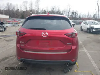 2020 Mazda CX-5 Grand Touring with VIN JM3KFADMXL0842026, listed as a IAAI auction lot 41477339 with 60,755 mi miles. Bid and sale history available at carsss.com. Image 16.