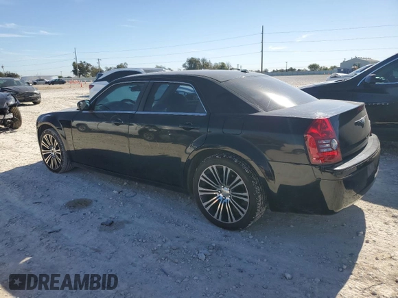 2010 Chrysler 300 with VIN 2C3CA2CV0AH279836, listed as a Copart auction lot 81843694 with 128,515 mi miles and Salvage Title. Bid and sale history available at carsss.com. Image 2.