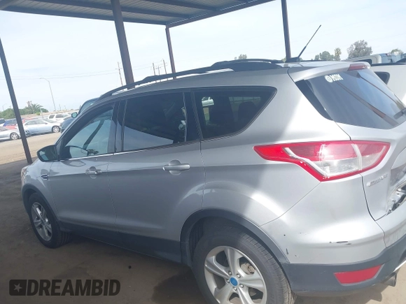 2013 Ford Escape SE with VIN 1FMCU0GX5DUB97293, listed as a IAAI auction lot 42044696 with 182,746 mi miles and . Bid and sale history available at DreamBid. Image 14.