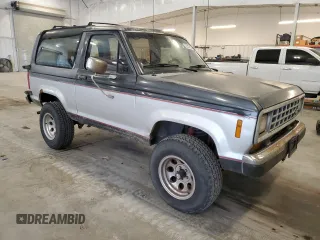 1988 Ford Bronco z VIN 1FMCU14T4JUA54161, wystawiony jako Copart lot #76312054 z przebiegiem 34 932 mil mil oraz Szkoda całkowita • Salvage title. Historia ofert i sprzedaży dostępna na DreamBid. Obrazek 4.