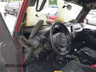 2012 Jeep Wrangler Sport with VIN 1C4AJWAG9CL203018, listed as a IAAI auction lot 42377899 with Not provided miles and . Bid and sale history available at DreamBid. Image 12.