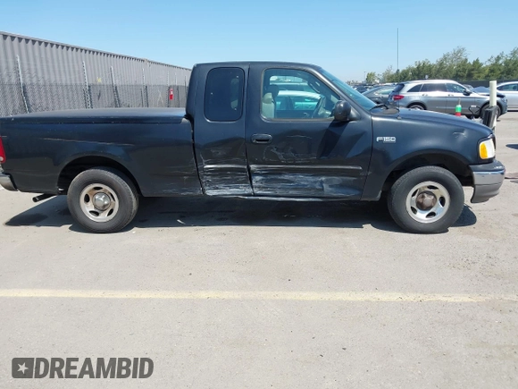 2003 Ford F-150 XL with VIN 1FTRX17213NB70553, listed as a IAAI auction lot 41946968 with 186,683 mi miles. Bid and sale history available at carsss.com. Image 6.
