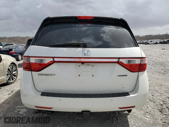 2012 Honda Odyssey Touring z VIN 5FNRL5H93CB070824, wystawiony jako Copart lot #49213465 z przebiegiem 287 745 mil mil oraz Szkoda całkowita • Salvage title. Historia ofert i sprzedaży dostępna na DreamBid. Obrazek 6.