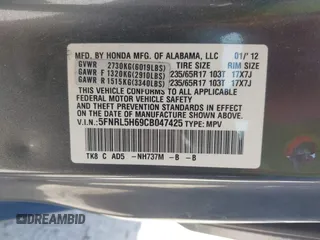 2012 Honda Odyssey EX-L with VIN 5FNRL5H69CB047425, listed as a IAAI auction lot 42064979 with 242,409 mi miles and . Bid and sale history available at carsss.com. Image 9.
