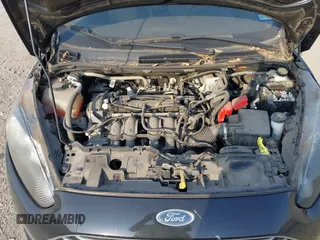 2018 Ford Fiesta SE z VIN 3FADP4BJXJM117051, wystawiony jako IAAI lot #42049956 z przebiegiem 27 367 mil mil oraz . Historia ofert i sprzedaży dostępna na DreamBid. Obrazek 10.
