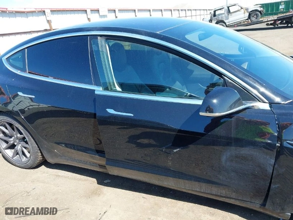 2019 Tesla Model 3 Mid Range with VIN 5YJ3E1EA3KF304286, listed as a IAAI auction lot 42066908 with 164,667 mi miles. Bid and sale history available at carsss.com. Image 13.