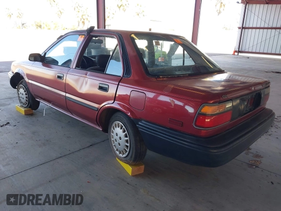 1990 Toyota Corolla z VIN 1NXAE94A1LZ117401, wystawiony jako IAAI lot #41755431 z przebiegiem 81 786 mil mil oraz . Historia ofert i sprzedaży dostępna na DreamBid. Obrazek 3.