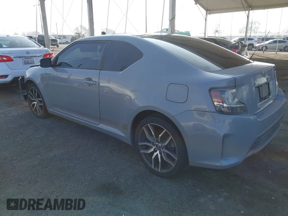 2014 Scion tC with VIN JTKJF5C7XE3079765, listed as a IAAI auction lot 41210220 with 114,410 mi miles. Bid and sale history available at carsss.com. Image 3.