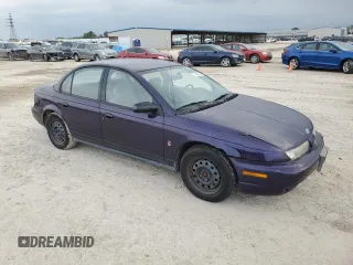 1996 Saturn SL with VIN 1G8ZK5278TZ255742, listed as a Copart auction lot 79050024 with 83,205 mi miles and Salvage title. Bid and sale history available at DreamBid. Image 4.