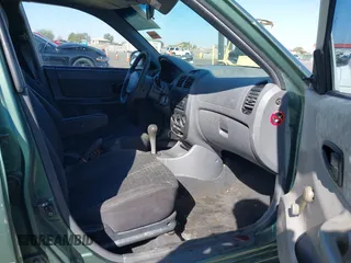 2005 Hyundai Accent GLS with VIN KMHCG45C95U620716, listed as a IAAI auction lot 41740573 with 187,971 mi miles. Bid and sale history available at carsss.com. Image 5.