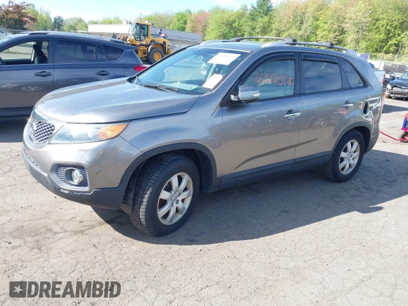 2012 Kia Sorento LX with VIN 5XYKT3A65CG266682, listed as a IAAI auction lot 42220120 with 118,153 mi miles and . Bid and sale history available at carsss.com. Image 2.