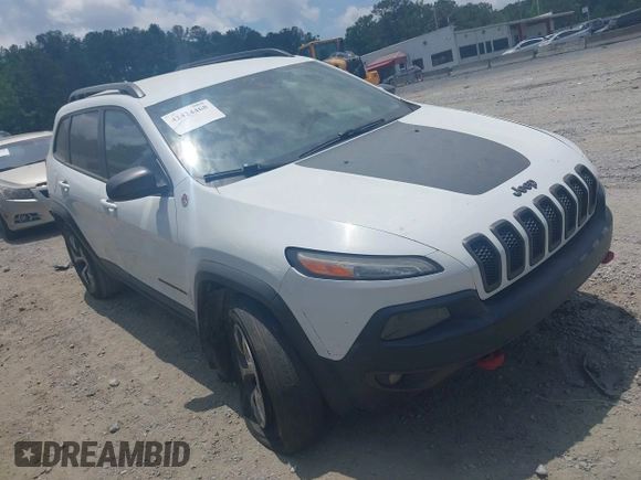 2015 Jeep Cherokee Trailhawk z VIN 1C4PJMBS3FW511564, wystawiony jako IAAI lot #42424468 z przebiegiem 169 167 mil mil oraz . Historia ofert i sprzedaży dostępna na DreamBid. Obrazek 1.