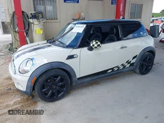 2007 MINI Hardtop with VIN WMWMF33557TL67653, listed as a IAAI auction lot 42581219 with 147,115 mi miles and . Bid and sale history available at DreamBid. Image 2.
