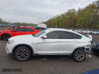 2018 BMW X4 xDrive28i with VIN 5UXXW3C57J0T82081, listed as a IAAI auction lot 41991254 with 100,654 mi miles. Bid and sale history available at carsss.com. Image 14.