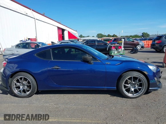 2013 Scion FR-S with VIN JF1ZNAA11D2702415, listed as a IAAI auction lot 40381041 with 63,581 mi miles. Bid and sale history available at carsss.com. Image 13.