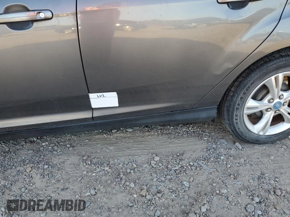 2013 Ford Focus SE z VIN 1FADP3F22DL233878, wystawiony jako Copart lot #52598475 z przebiegiem 131 539 mil mil oraz Szkoda całkowita • Salvage title. Historia ofert i sprzedaży dostępna na DreamBid. Obrazek 12.