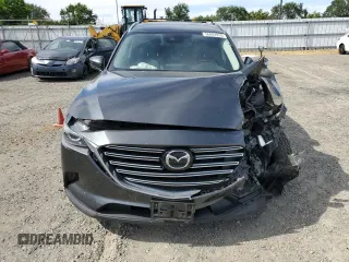 2019 Mazda CX-9 Touring with VIN JM3TCBCY0K0309947, listed as a Copart auction lot 56897815 with 87,517 mi miles and Salvage title. Bid and sale history available at DreamBid. Image 5.