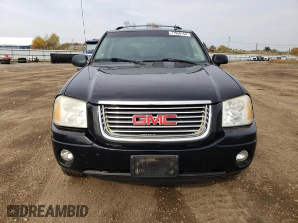 2007 GMC Envoy SLT with VIN 1GKDT13S972197393, listed as a Copart auction lot 77958764 with 151,586 mi miles and Salvage Title. Bid and sale history available at DreamBid. Image 5.