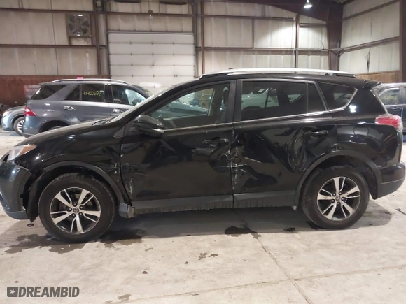 2017 Toyota RAV4 XLE with VIN 2T3RFREV0HW669312, listed as a IAAI auction lot 41410721 with 99,404 mi miles. Bid and sale history available at carsss.com. Image 14.