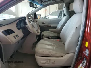 2011 Toyota Sienna XLE AAS with VIN 5TDYK3DC8BS024209, listed as a Copart auction lot 58923715 with 134,051 mi miles and Salvage title. Bid and sale history available at DreamBid. Image 7.