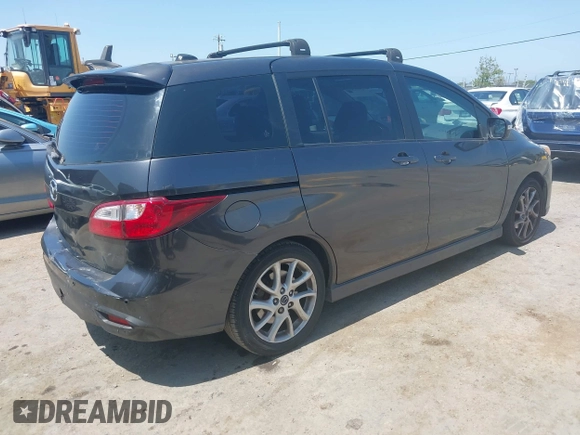 2014 Mazda 5 Grand Touring with VIN JM1CW2DL8E0171095, listed as a IAAI auction lot 41962650 with 85,048 mi miles and . Bid and sale history available at DreamBid. Image 4.