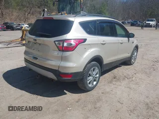2017 Ford Escape SE with VIN 1FMCU9GD1HUD23228, listed as a IAAI auction lot 42074213 with 115,757 mi miles. Bid and sale history available at carsss.com. Image 4.