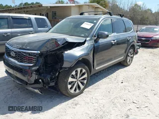 2020 Kia Telluride S with VIN 5XYP64HC4LG048473, listed as a IAAI auction lot 41901438 with 125,089 mi miles and . Bid and sale history available at DreamBid. Image 2.