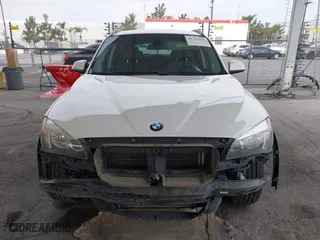 2015 BMW X1 sDrive28i with VIN WBAVM1C53FV318663, listed as a IAAI auction lot 41711526 with 182,204 mi miles. Bid and sale history available at carsss.com. Image 12.