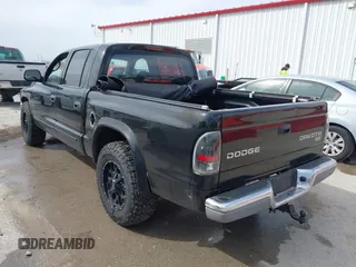 2004 Dodge Dakota SLT with VIN 1D7HL48N04S654059, listed as a IAAI auction lot 41811540 with 165,615 mi miles. Bid and sale history available at carsss.com. Image 3.